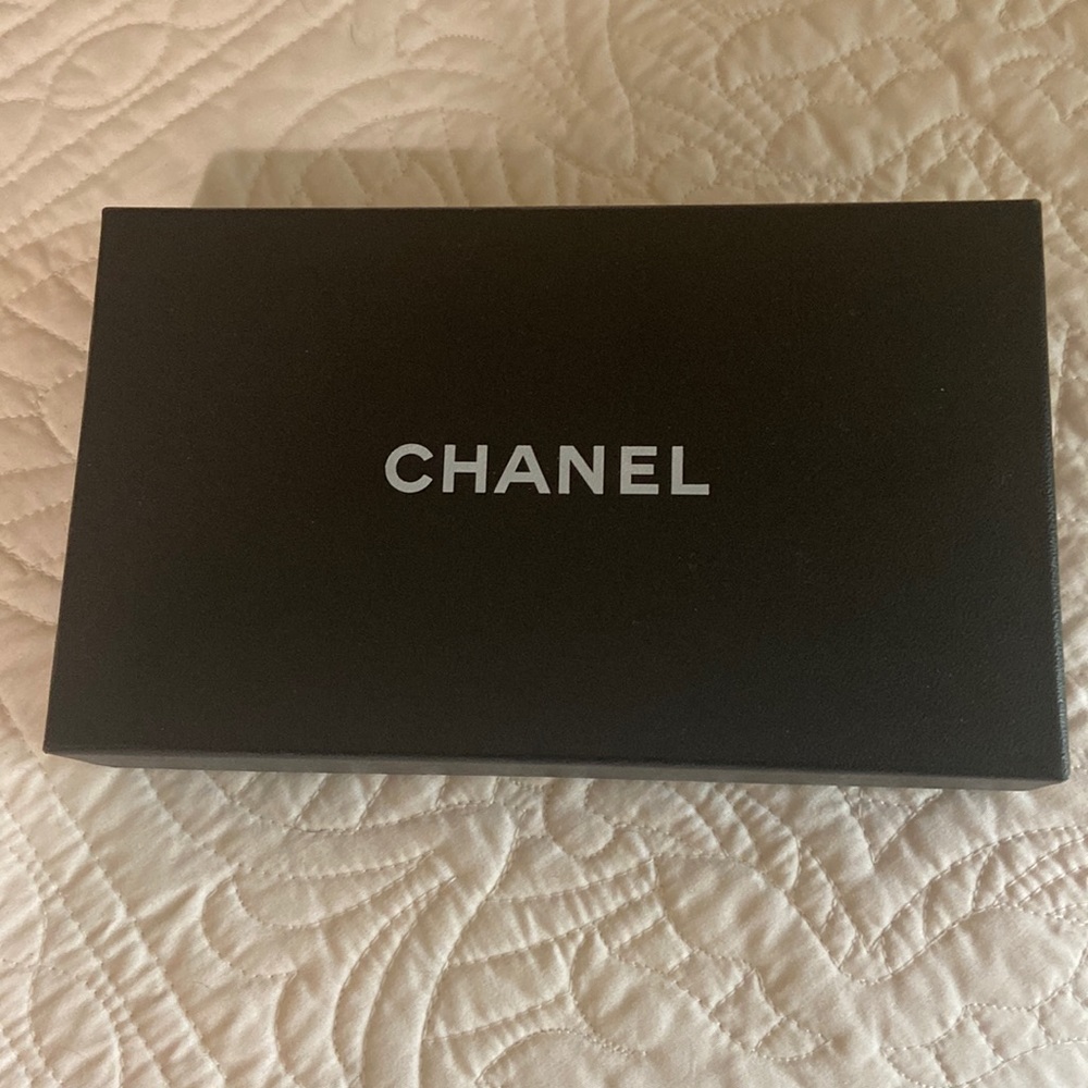 Chanel black wallet. Calfskin/lamb skin Leather.  Comes with box dust cover.